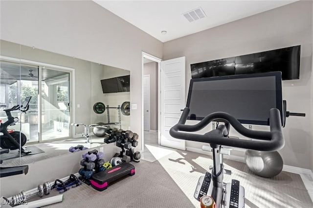 workout area featuring baseboards and visible vents