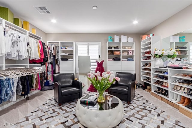 spacious closet featuring visible vents and carpet flooring