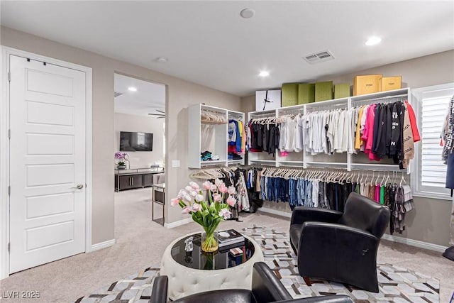 walk in closet featuring visible vents and carpet floors