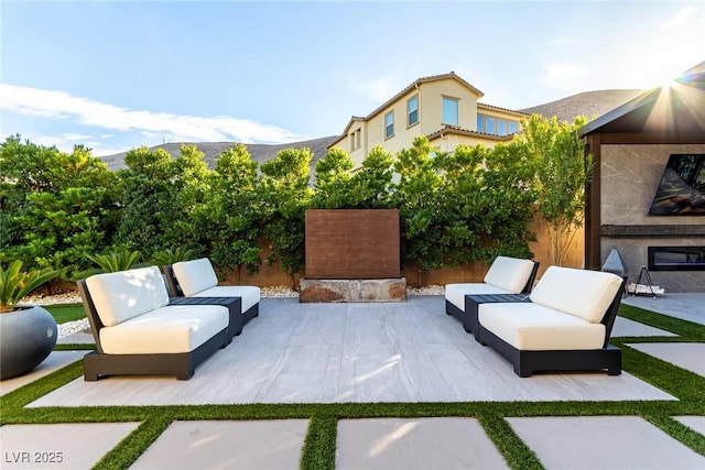 view of patio / terrace featuring an outdoor living space and a fenced backyard