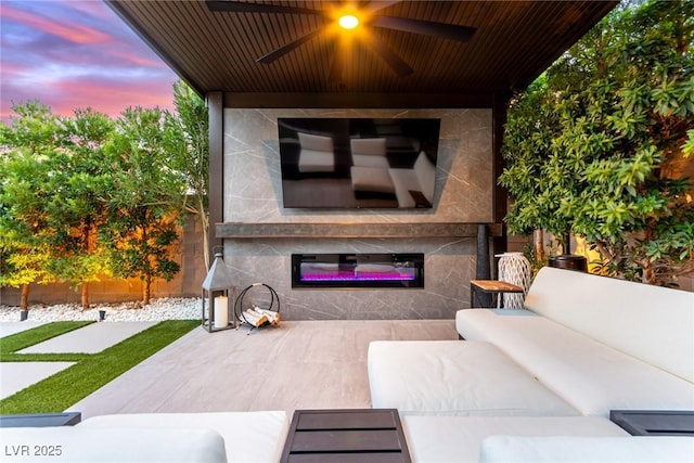 view of patio with outdoor lounge area and ceiling fan