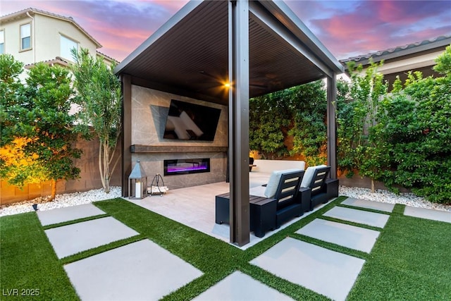 view of patio with fence and an outdoor hangout area