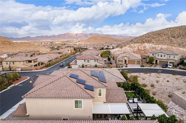 birds eye view of property with a residential view and a mountain view