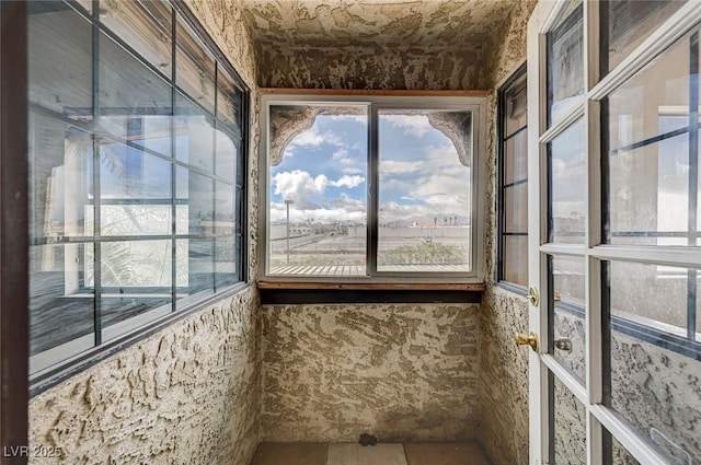 unfurnished sunroom with a healthy amount of sunlight