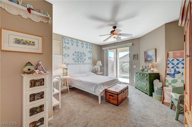 bedroom featuring a ceiling fan, access to exterior, and carpet flooring