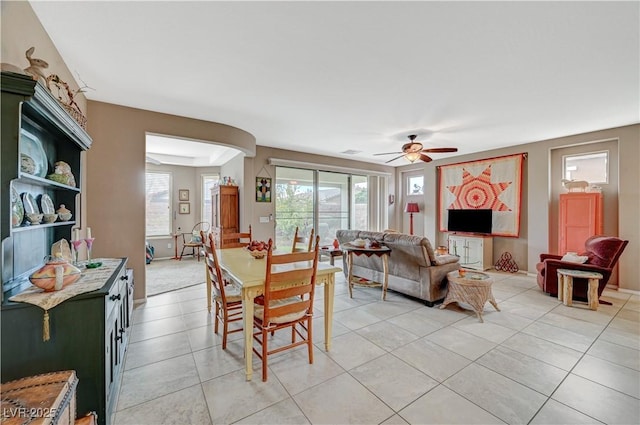 dining area with light tile patterned flooring, a ceiling fan, and visible vents