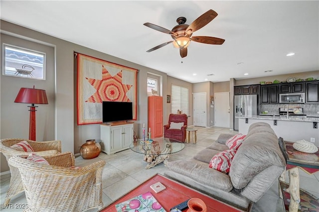 living area featuring light tile patterned floors, recessed lighting, and ceiling fan