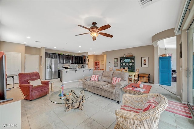 living room with recessed lighting, visible vents, ceiling fan, and light tile patterned flooring