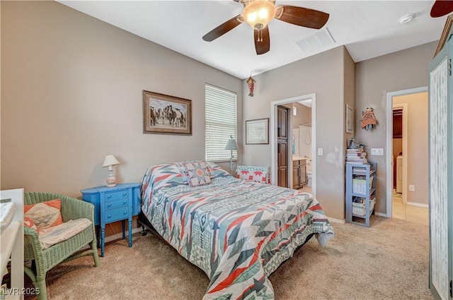 carpeted bedroom featuring ceiling fan, visible vents, washer / clothes dryer, and connected bathroom