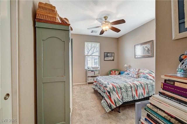 bedroom featuring visible vents, carpet floors, and a ceiling fan