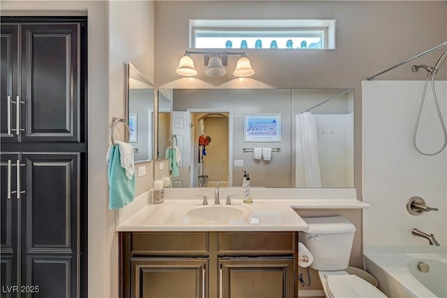 full bath featuring shower / bathtub combination with curtain, toilet, and vanity