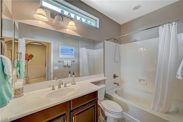 full bathroom featuring shower / tub combo with curtain, vanity, and toilet