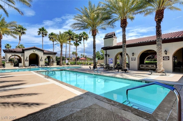 community pool with a patio