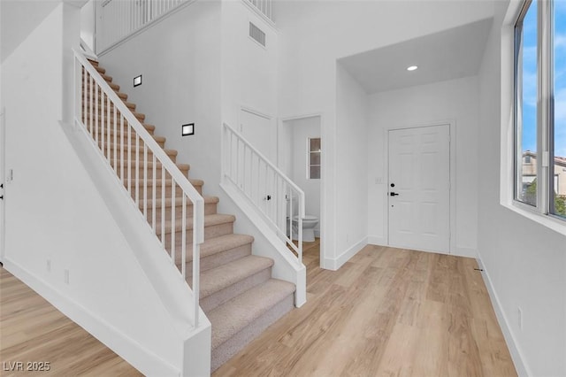 entrance foyer with visible vents, recessed lighting, light wood-type flooring, and baseboards