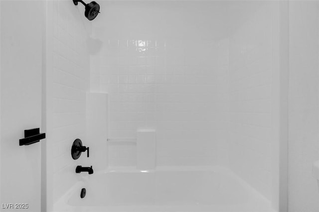 details featuring bathing tub / shower combination