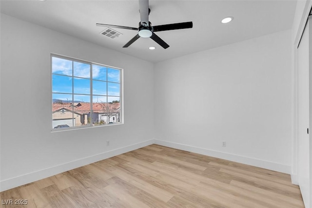 empty room featuring recessed lighting, visible vents, baseboards, and light wood finished floors