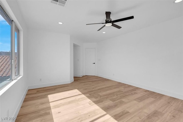 unfurnished room featuring recessed lighting, visible vents, baseboards, and light wood-style flooring