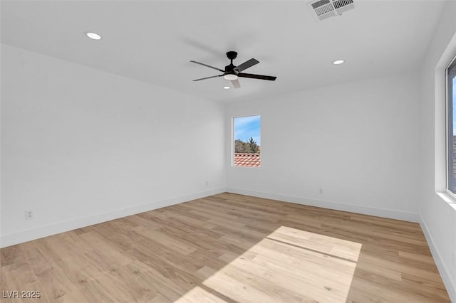 empty room featuring visible vents, recessed lighting, baseboards, and light wood-style floors