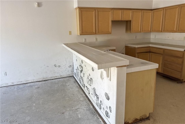 kitchen featuring tile countertops