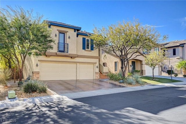 view of front of property featuring concrete driveway, an attached garage, a residential view, and stucco siding