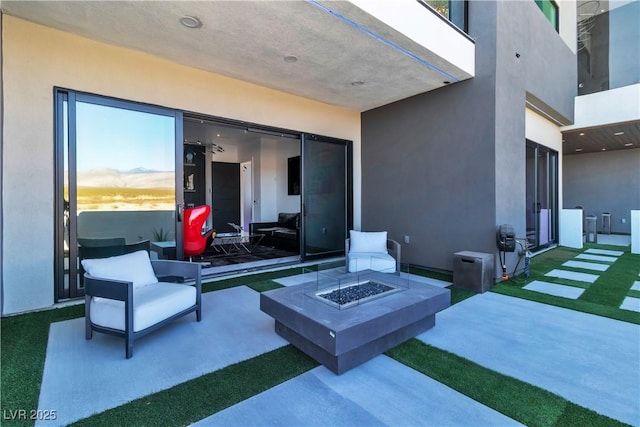 view of patio with a fire pit