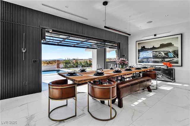 dining room featuring marble finish floor