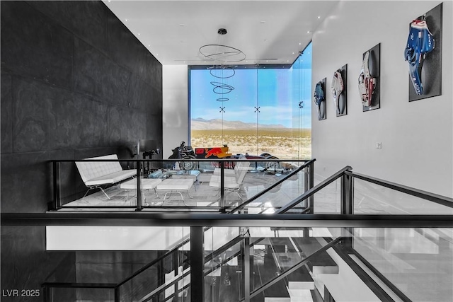 interior space featuring floor to ceiling windows and a mountain view