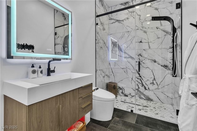 full bathroom with vanity, toilet, and a marble finish shower