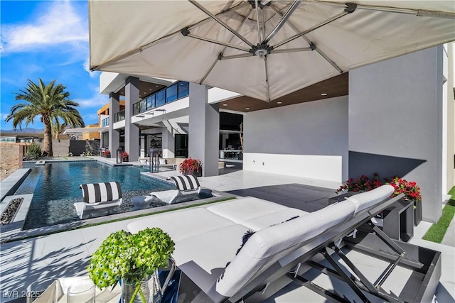 view of swimming pool with a patio area, a fenced in pool, and fence