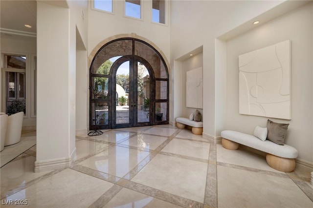 9801 Orient Express Ct, Las Vegas, NV 89145 - entryway with arched walkways, baseboards, french doors, and marble finish floor
