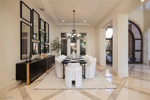 9801 Orient Express Ct, Las Vegas, NV 89145 - dining space with visible vents, baseboards, recessed lighting, arched walkways, and a notable chandelier