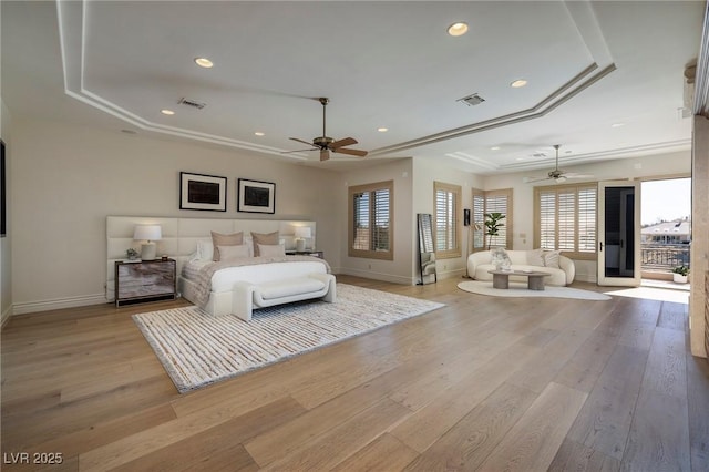 9801 Orient Express Ct, Las Vegas, NV 89145 - bedroom with visible vents, baseboards, recessed lighting, light wood-type flooring, and a tray ceiling