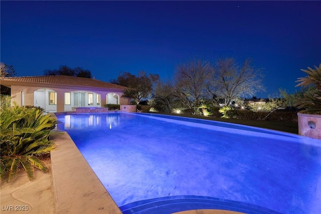 9801 Orient Express Ct, Las Vegas, NV 89145 - pool at twilight with an outdoor pool