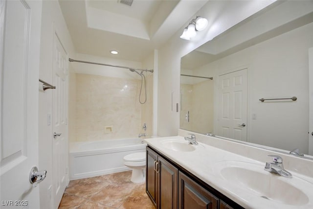 full bath with double vanity, toilet, washtub / shower combination, and a sink