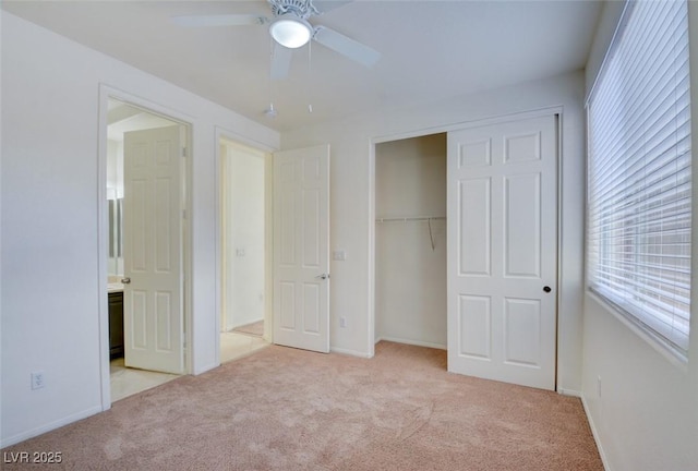 unfurnished bedroom with a ceiling fan, a closet, and carpet floors