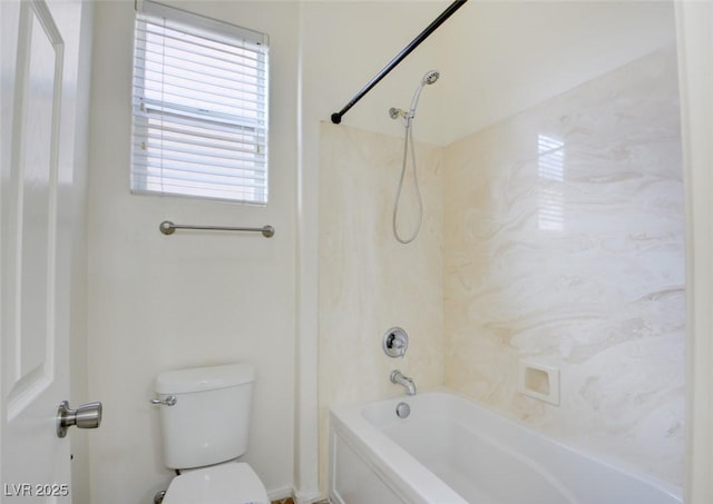 bathroom featuring toilet and  shower combination