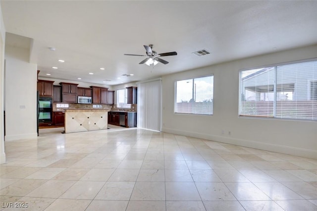 unfurnished living room featuring recessed lighting, visible vents, baseboards, and a ceiling fan