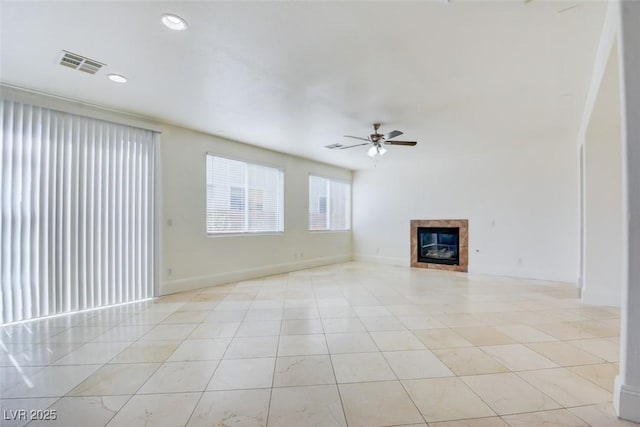 unfurnished living room with visible vents, recessed lighting, a fireplace, light tile patterned flooring, and a ceiling fan