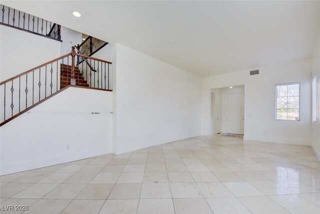 spare room with tile patterned floors, visible vents, recessed lighting, and stairs