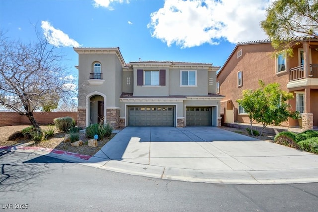 view of front of house with fence, driveway, an attached garage, stucco siding, and stone siding