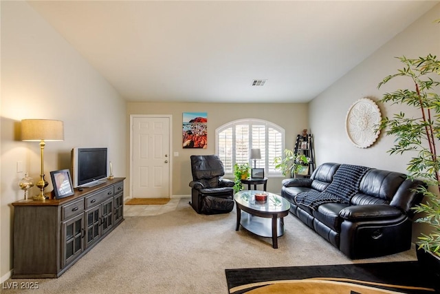 living room featuring vaulted ceiling, light colored carpet, visible vents, and baseboards