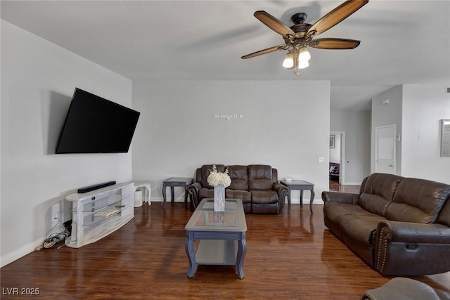 living area featuring a ceiling fan, wood finished floors, and baseboards