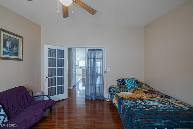 bedroom featuring a ceiling fan and wood finished floors