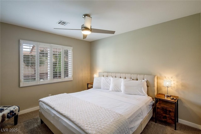 carpeted bedroom with visible vents, baseboards, and ceiling fan