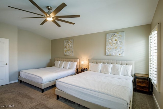 carpeted bedroom featuring vaulted ceiling, baseboards, and ceiling fan