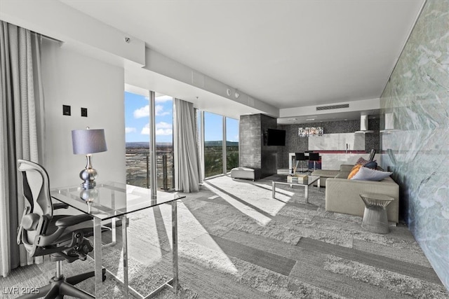 living area featuring carpet flooring and visible vents