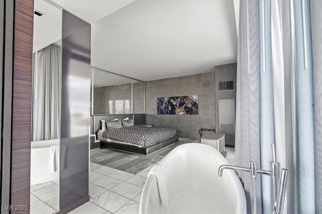 bedroom featuring visible vents and marble finish floor