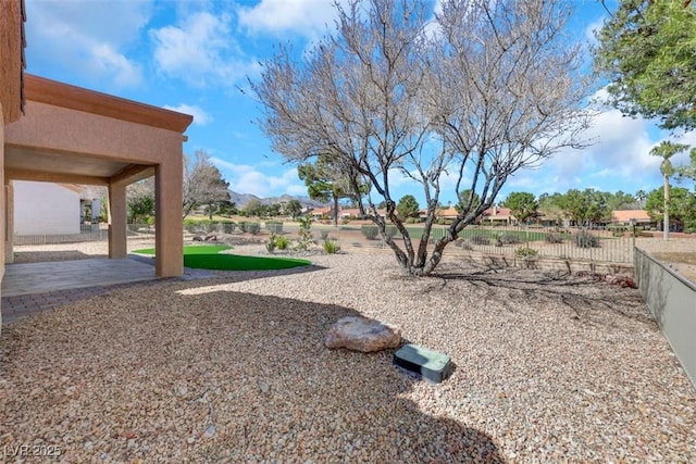 view of yard featuring a patio and fence