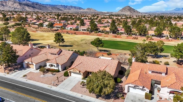 aerial view featuring a mountain view, a residential view, and golf course view