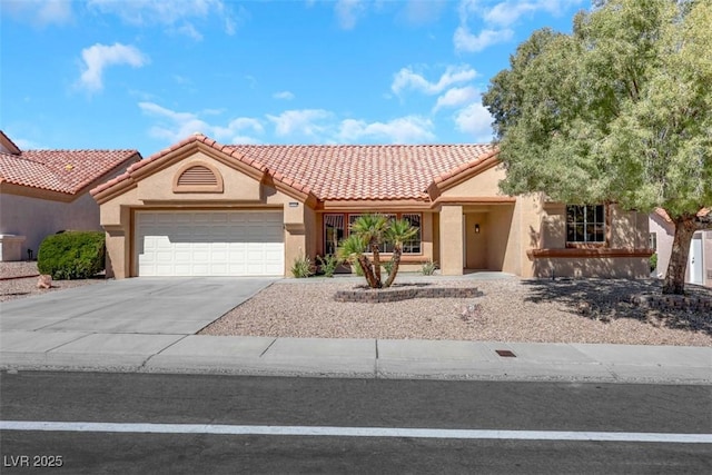 view of front facade featuring stucco siding, a garage, concrete driveway, and a tile roof